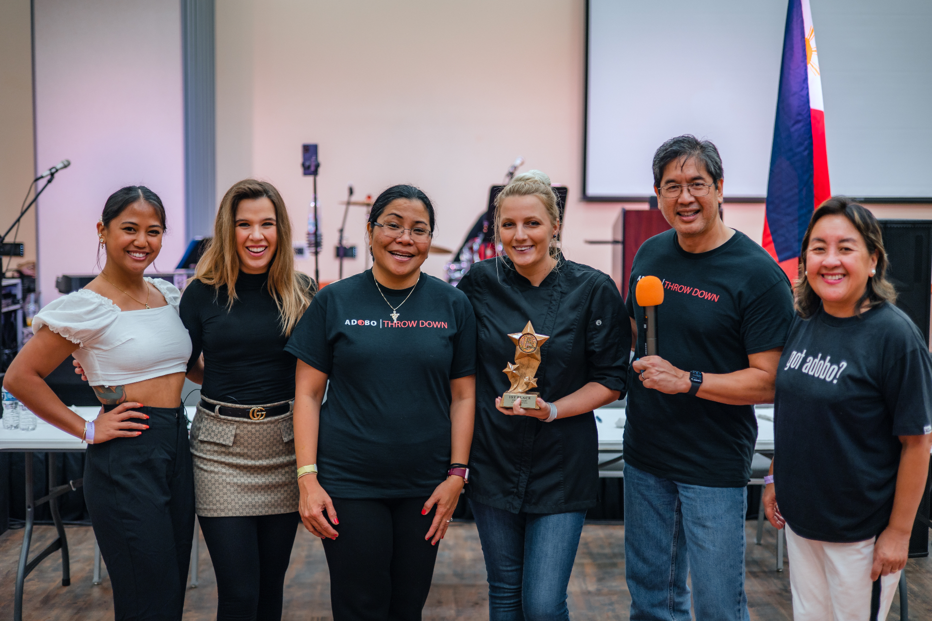 Ube Throwdown community celebrating a winner with trophies.